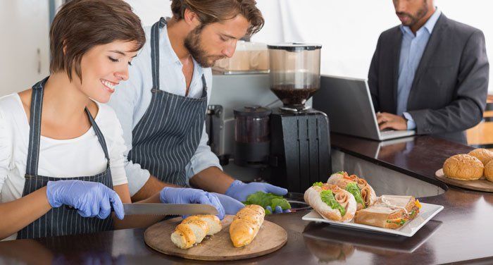 making sandwiches in a retail store